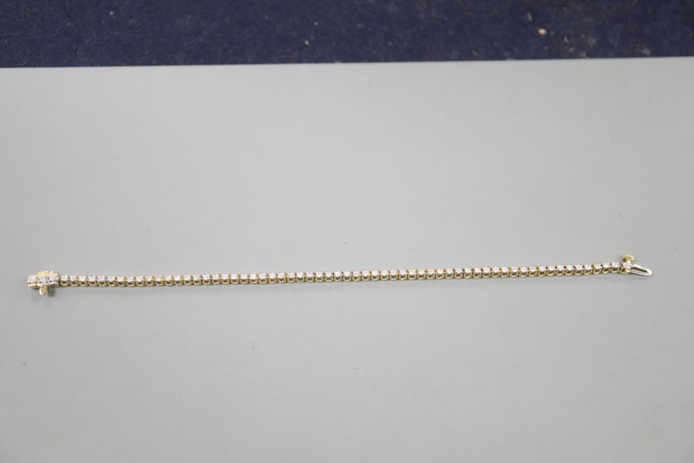 A modern 9ct gold and diamond set line bracelet, 17.7cm, gross 7 grams,